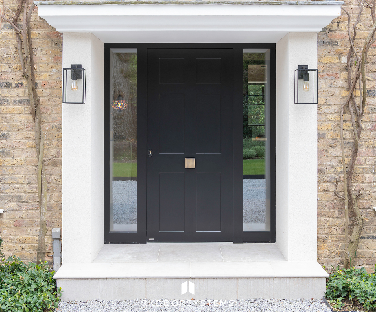 Closed pivot door showing flush threshold and concealed hardware