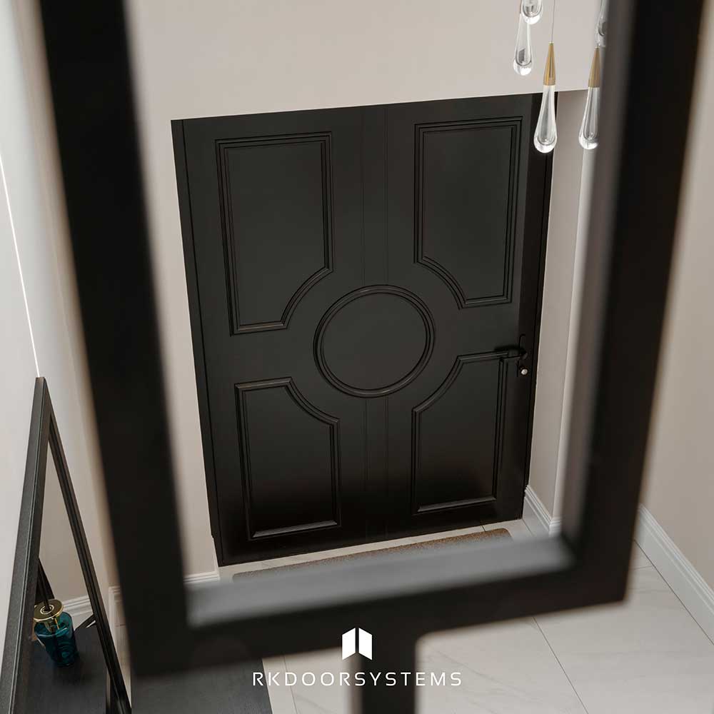 Wide hallway view of a traditional aluminium entrance door from inside the home
