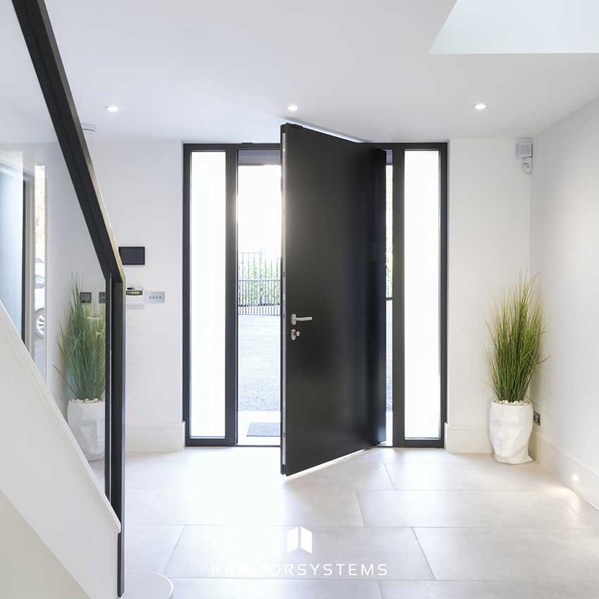 Interior of an XL pivot door from a contemporary atrium