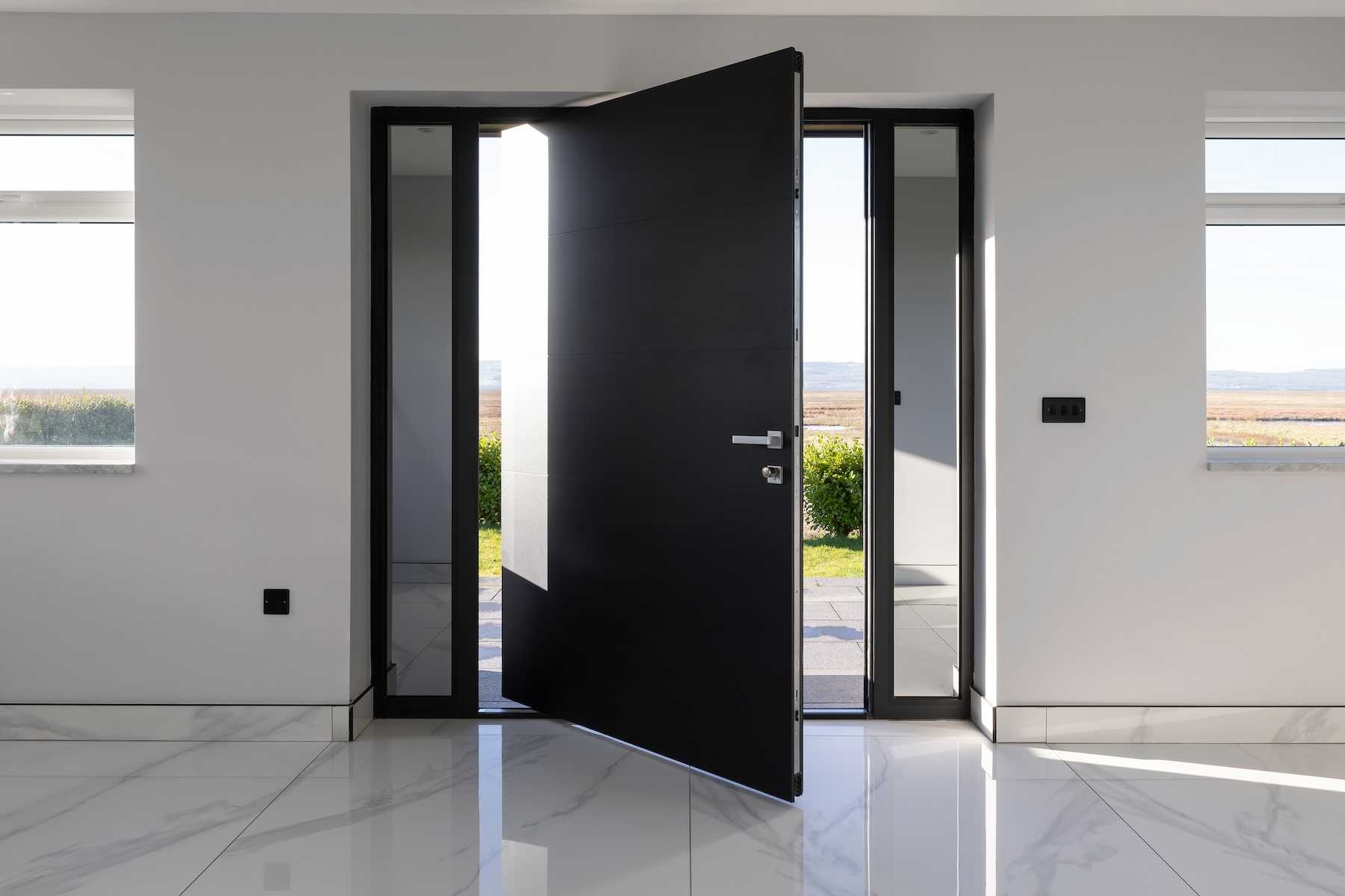 RK Door Systems pivot door on modern architectural property
