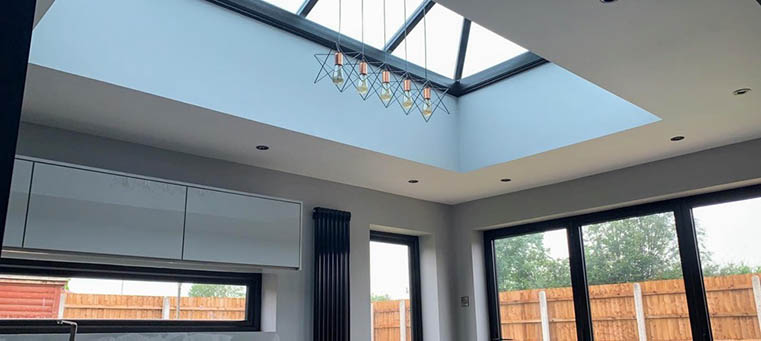 Interior view of a glazed roof lantern over an open-plan kitchen