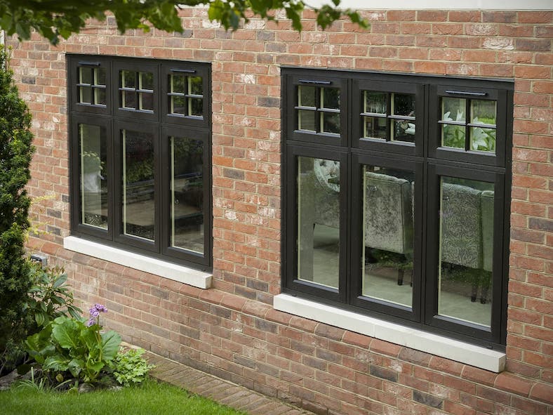 Residence Collection flush casement windows in black on a red-brick property